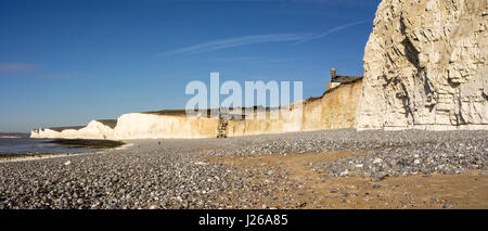 Panoramic view on a sunny winters day, of the chalk cliffs looking towards Cuckmere Haven, from Birling Gap near Eastbourne, East Sussex, UK (21x9). Stock Photo