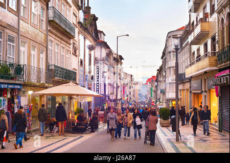 PORTO, PORTUGAL - NOV 27, 2016: People walking on Rua Santa Catarina at twilight. Santa Catarina is a main shopping street of Porto. Stock Photo