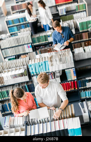 Students learning, reading in the library,view from above Stock Photo