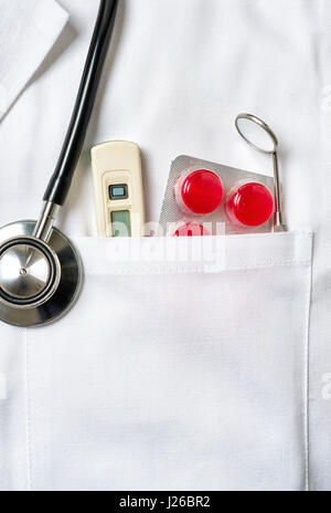 Doctor with medical utensils in his pocket Stock Photo