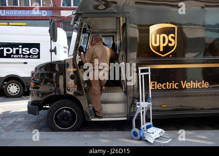Brown UPS electric delivery vehicle Stock Photo