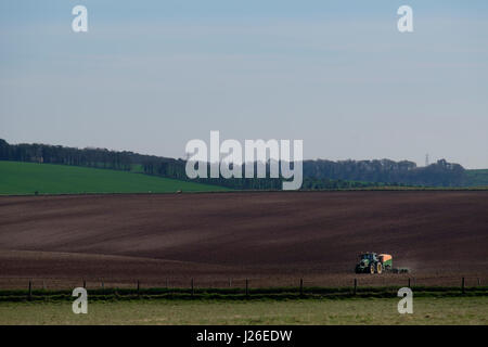 Tractor plowing farm land Stock Photo