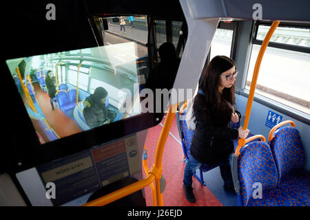CCTV screen showing the inside of a bus in London Stock Photo