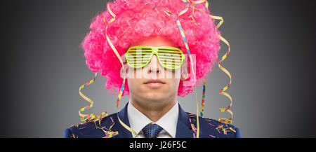 Funny businessman in pink wig Stock Photo