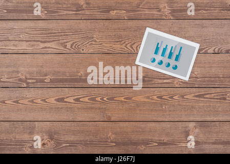 White digital tablet on wooden table Stock Photo