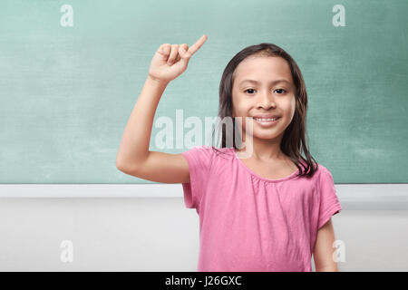 Portrait of asian little girl thinking and having idea in the classroom Stock Photo