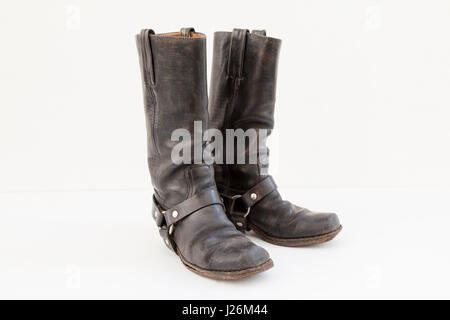 black pair of vintage boots isolated on white background Stock Photo