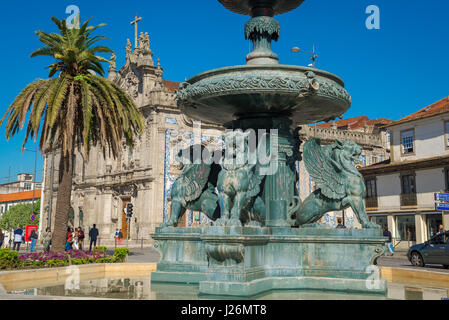 Porto Portugal fountain, the Fountain of Lions sited in the centre of the Praca de Gomez Teixeira near the azulejos covered Igreja do Carmo church. Stock Photo