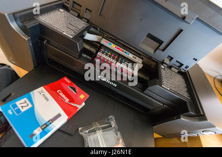 Replacing printer ink cartridge on Canon Pixma Pro-10   Model Release: No.  Property Release: No. Stock Photo