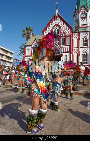 Female members of a Tobas dance group in ornate costumes performing at the annual Carnaval Andino con la Fuerza del Sol in Arica, Chile. Stock Photo