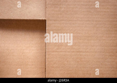 Folded cardboard box cover close up. Texture and background with copy space Stock Photo
