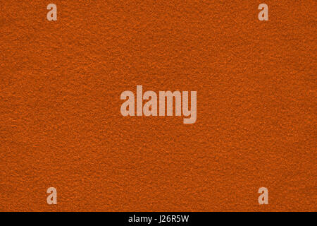 Dark orange (bronze) felt surface close up. Texture and background Stock Photo