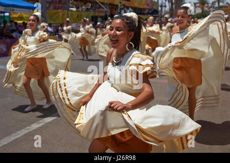 Group of dancers of Africa descent (Afrodescendiente) performing at the annual Carnaval Andino con la Fuerza del Sol in Arica, Chile. Stock Photo