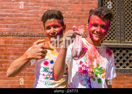 Portraits of young people, smeared with color, are celebrating the Holi Festival Stock Photo