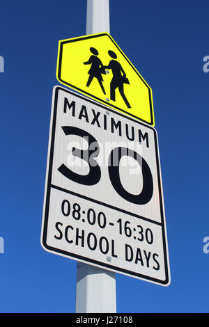 Speed Limit Sign in School Zone Stock Photo