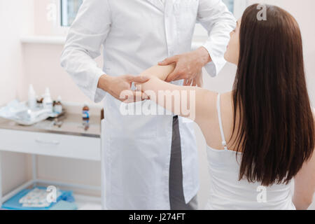 Nice pleasant woman holding her hand up Stock Photo