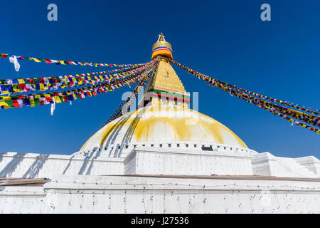 The Bouda Stupa is the centre of buddhist spirituality in town, the white building is decorated by colorful tibetean prayerflags Stock Photo