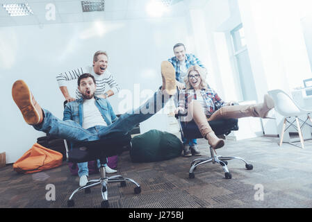 Low angle of cheerful office workers having fun Stock Photo