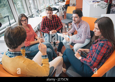 Shot of a group of young business professionals having a meeting. Stock Photo