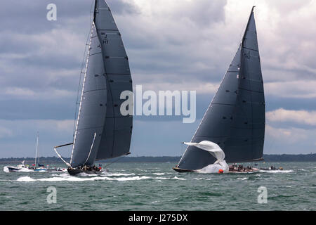 J-Class yacht 'Lionheart' (H1) leads 'Rainbow' (H2) round the first windward mark in the J Class Solent Regatta, July 2012: spinnakers being set Stock Photo