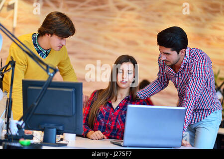 Teamwork. Three young architects working on a project Stock Photo