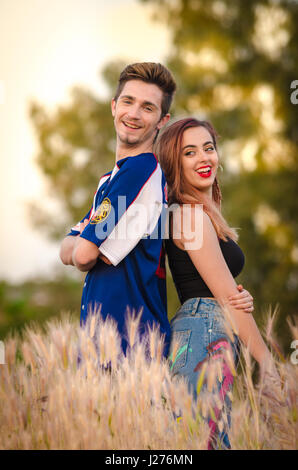 Portrait of a happy young couple in summer clothes outdoor Stock Photo