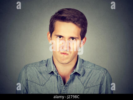 Annoyance. Angry displeased young man Stock Photo