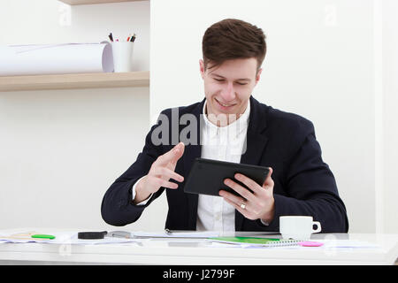 young man using a digital tablet Stock Photo