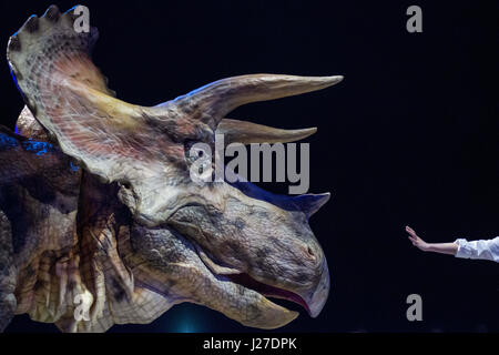 Tokyo, Tokyo, Japan. 25th Apr, 2017. The Dino-Safari exhibition featuring robotic dinosaurs. The rubber creatures make use of a 'Dino-Tronics' mechanism, which allows them to smoothly and quietly walk around, and move their heads and jaws. However the dinosaurs are not completely autonomous - performers encased in the models control their movements.The animatronics were created by Japanese firm ON-ART Corp. Credit: Alessandro Di Ciommo/ZUMA Wire/Alamy Live News Stock Photo