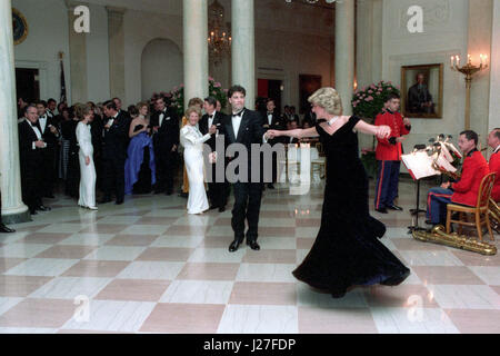 In this photo provided by the Ronald Reagan Presidential Library Princess Diana dances with John Travolta in the Cross Hall of the White House in Washington, DC at a Dinner for Prince Charles and Princess Diana of the United Kingdom on November 9, 1985. Mandatory Credit: Pete Souza - Courtesy Ronald Reagan Library via CNP - NO WIRE SERVICE- Photo: Pete Souza/Consolidated News Photos/Pete Souza - Courtesy Ronald Reagan Library via CNP Stock Photo