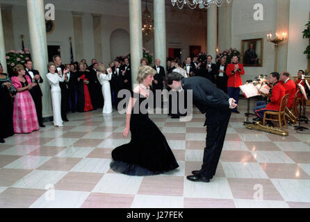 In this photo provided by the Ronald Reagan Presidential Library, Princess Diana dances with John Travolta in the Cross Hall of the White House in Washington, DC at a Dinner for Prince Charles and Princess Diana of the United Kingdom on November 9, 1985. Mandatory Credit: Pete Souza - Courtesy Ronald Reagan Library via CNP - NO WIRE SERVICE- Photo: Pete Souza/Consolidated News Photos/Pete Souza - Courtesy Ronald Reagan Library via CNP Stock Photo