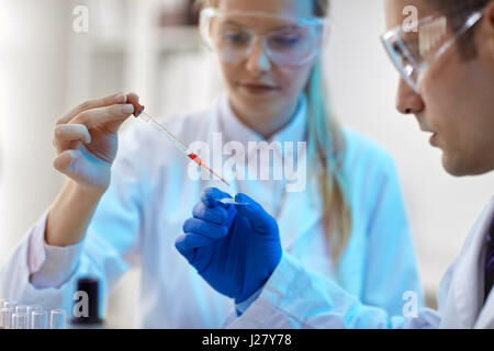 Research in laboratory - scientist working with DNA Stock Photo