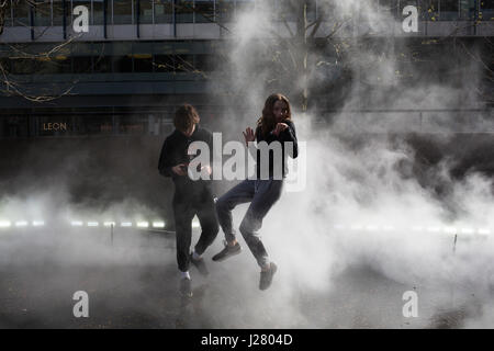 Japanese artist Fujiko Nakaya’s cloud of mist, fog sculpture outside Tate Modern Switch House as part of a new live exhibition programme on March 31st 2017 in London, United Kingdom. Fujiko Nakaya is known for her immersive sculptures, made from water vapour, which are highly interactive with the art audience. Stock Photo
