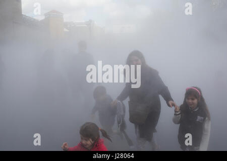 Japanese artist Fujiko Nakaya’s cloud of mist, fog sculpture outside Tate Modern Switch House as part of a new live exhibition programme on March 31st 2017 in London, United Kingdom. Fujiko Nakaya is known for her immersive sculptures, made from water vapour, which are highly interactive with the art audience. Stock Photo