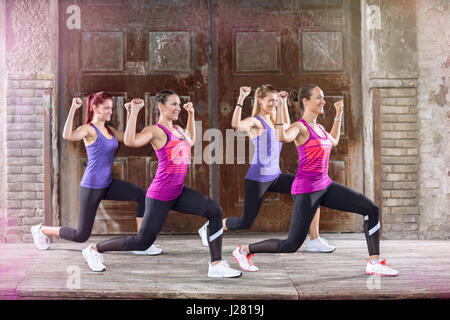 Young sportswoman practices vive dressed in colorful athletic shirts outside Stock Photo