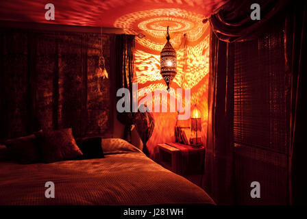 Moroccan bedroom with Moroccan lamp at night Stock Photo