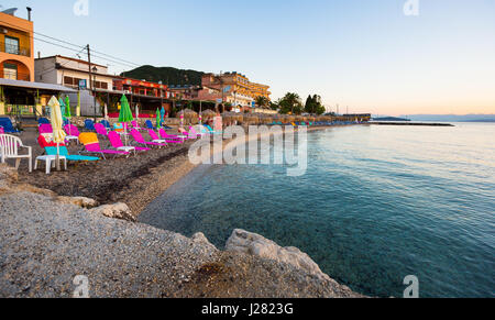 Corfu, Greece -August 18, 2015: Beautiful beach in Benitses on Corfu, view on beach at sunrise, Kerkyra (Corfu), Greece Stock Photo