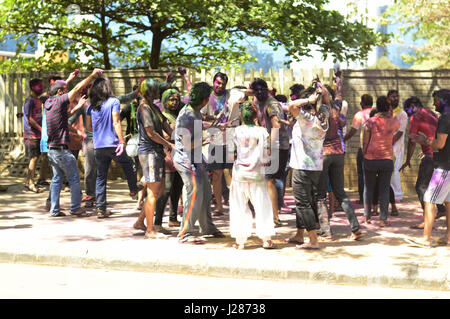 Youth dancing on music during holi festival in Pune, Maharashtra Stock Photo
