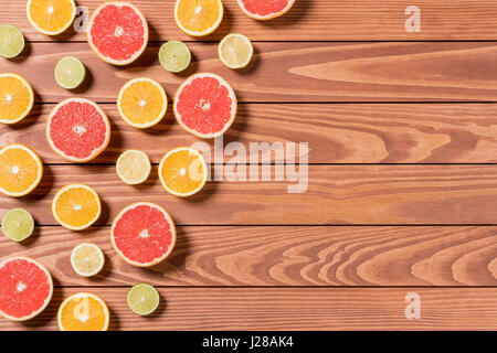 Sliced fruits on brown wooden table Stock Photo