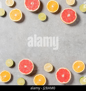 Sliced fruits on gray stone table Stock Photo