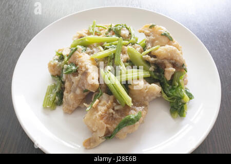 Thai cuisine , Deep fried fish stir with celery Stock Photo