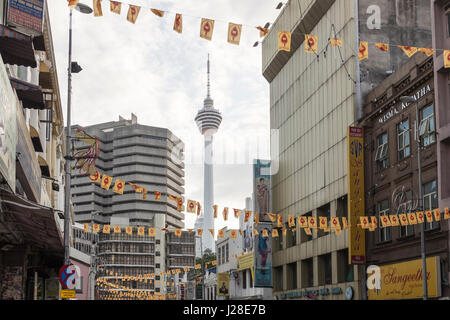 The KL Tower is seen through the buildings in downtown Kuala Lumpur, Malaysia Stock Photo