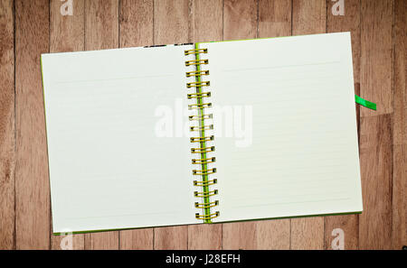Spiral leather notebook on desk Stock Photo