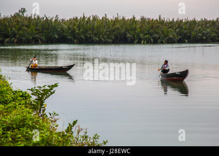 2 rural asian fishermen on a river in hoi an, Vietnam. Stock Photo