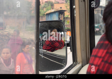 Nepal, Central Region, Chandragiri, Annapurna Circuit - Drive Kathmandu to Bhulbhule - Snapshot in the rear mirror with a Nepalese bus Stock Photo