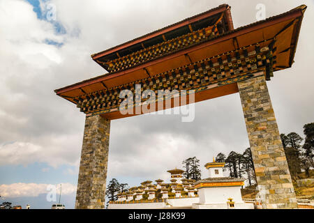 The stupas in the Druk Wangyal Chortens in the Dochula pass of Bhutan under a cloudy sky Stock Photo