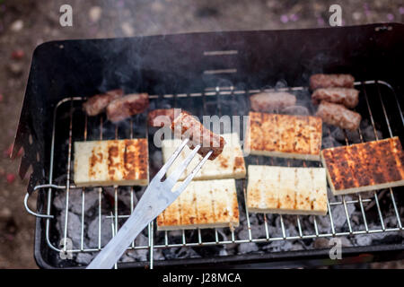 grilled cevapcici and cheese balkan cuisine Stock Photo