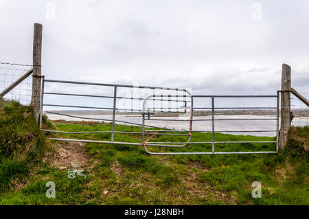 Makeshift farm fencing and gate with rope, County Donegal, Ireland Stock Photo