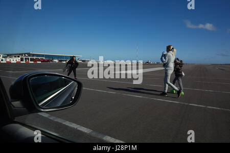Gibraltar, airport, cars and passengers crosses the runway, which is crossed from the main road 'Winston-Churchill Avenue' Stock Photo