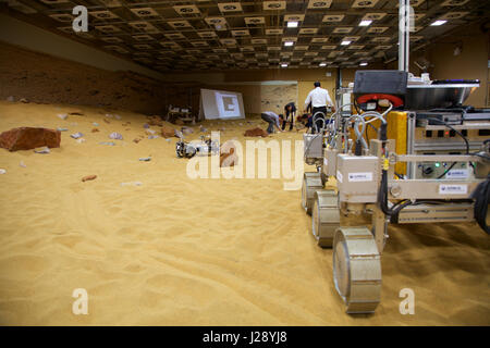 A small scout prototypes for the ESA ExoMars rover mission to Mars is tested by Airbus in a warehouse made to look like the Red Planet Stock Photo